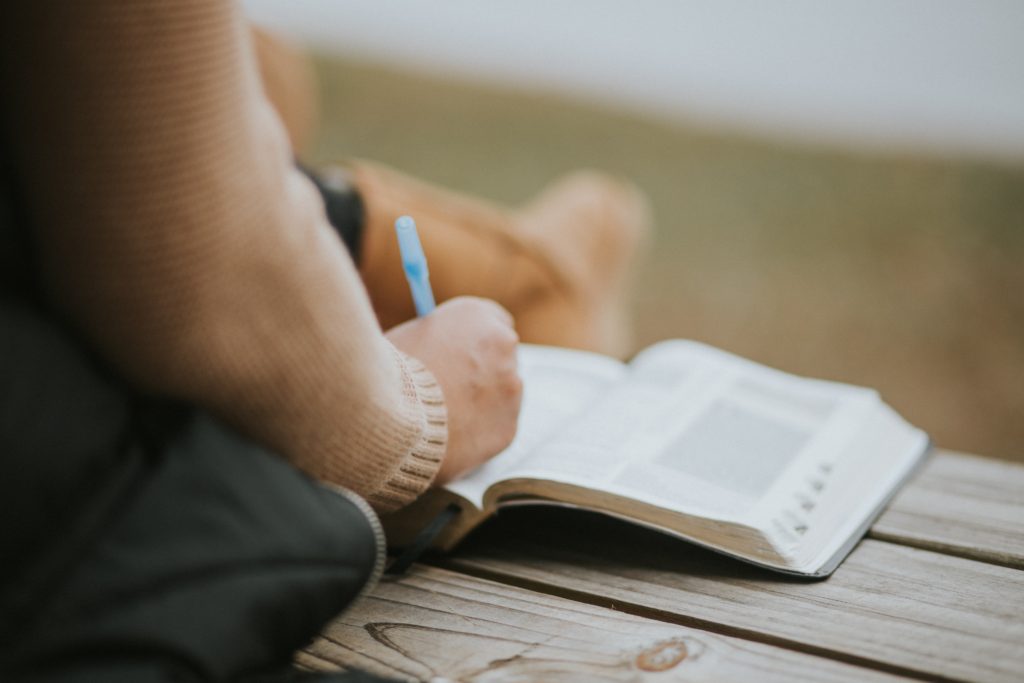 woman journaling in her bible