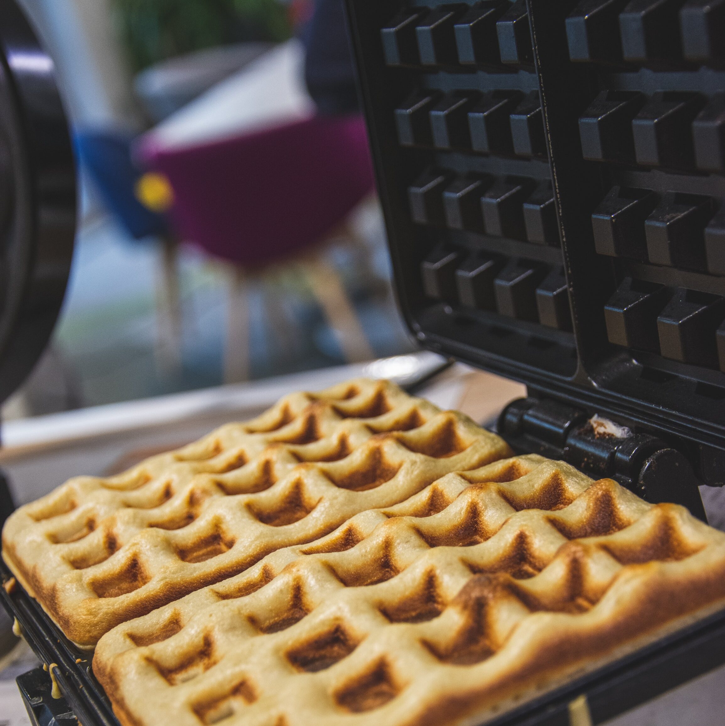 close up of waffles on a waffle iron