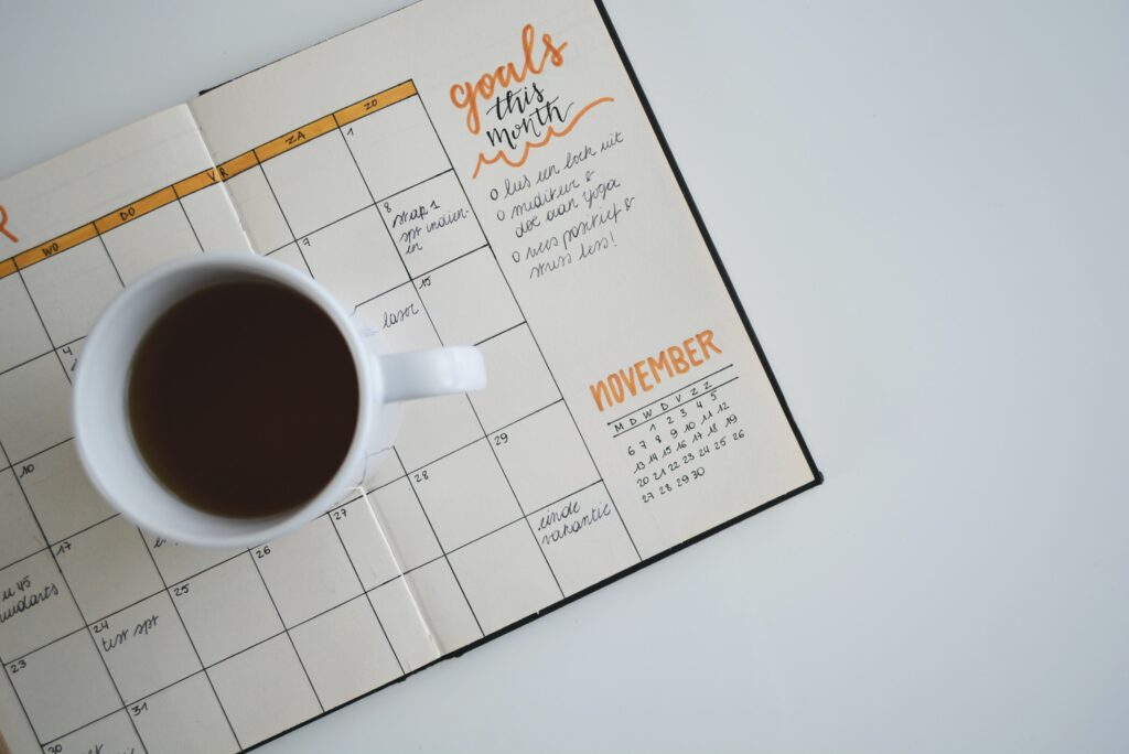 open calendar planner and a cup of coffee