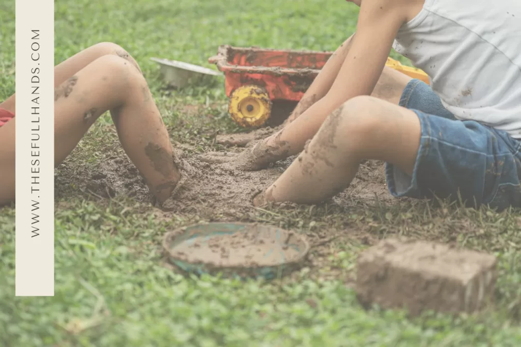 up close of kids playing in the mud