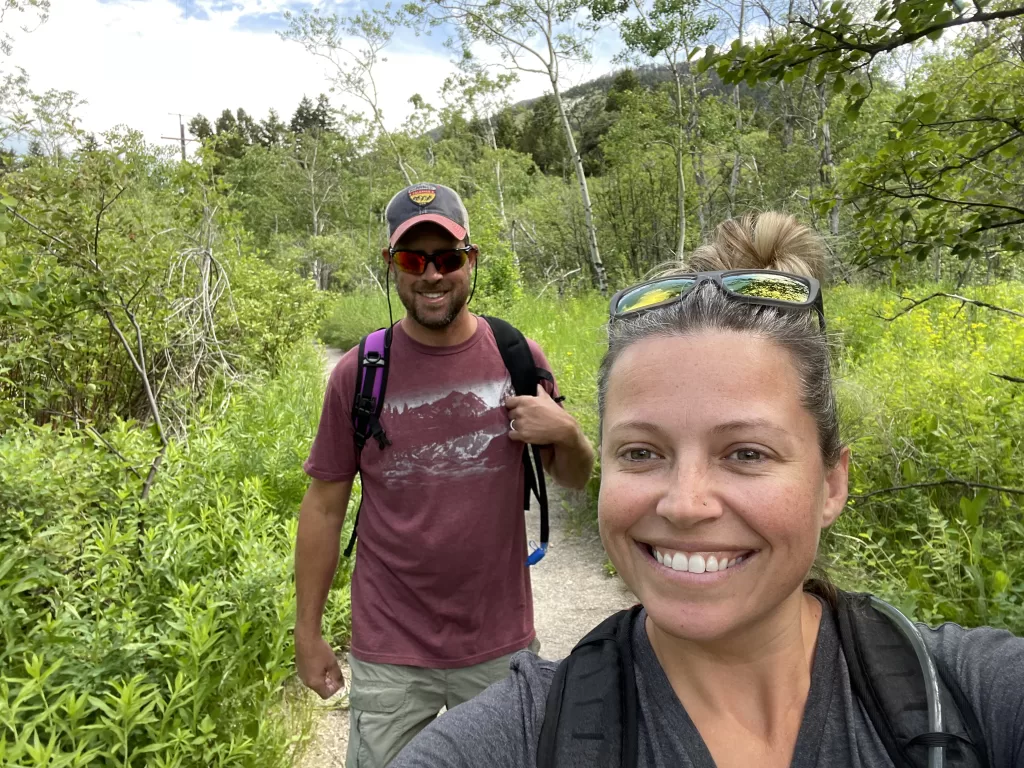 man and wife hiking together