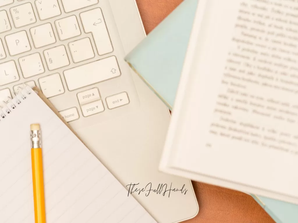 book, computer, and pencil up close