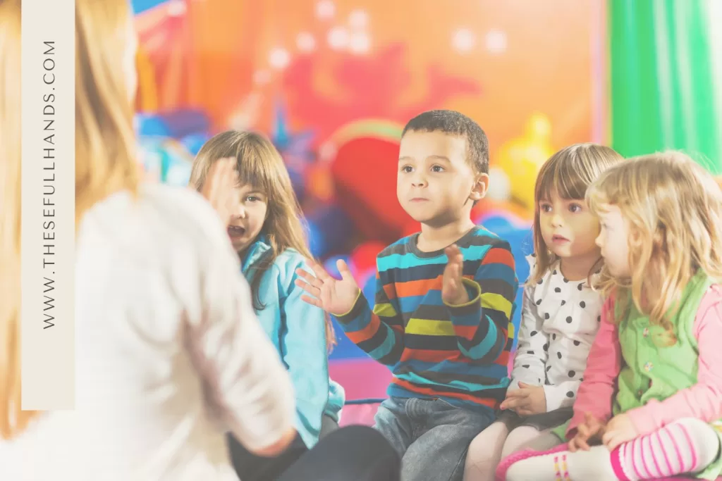 kids sitting in a semi circle singing songs with a teacher