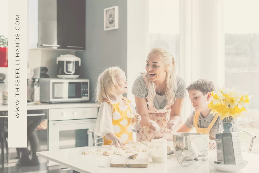 woman cooking with a little boy and a little girl in the kitchen