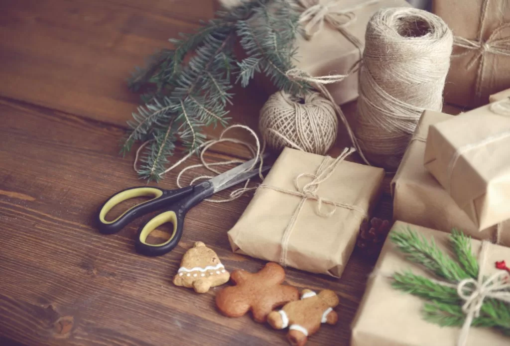 brown paper packages of handmade gifts with holiday accessories