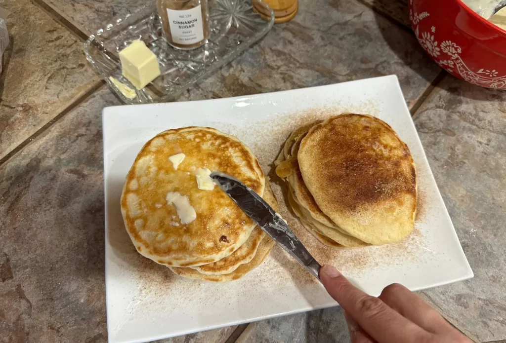 generous pat of butter on top of hot pancake stack