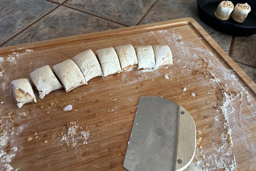 rolled up cinnamon roll dough cut into segments