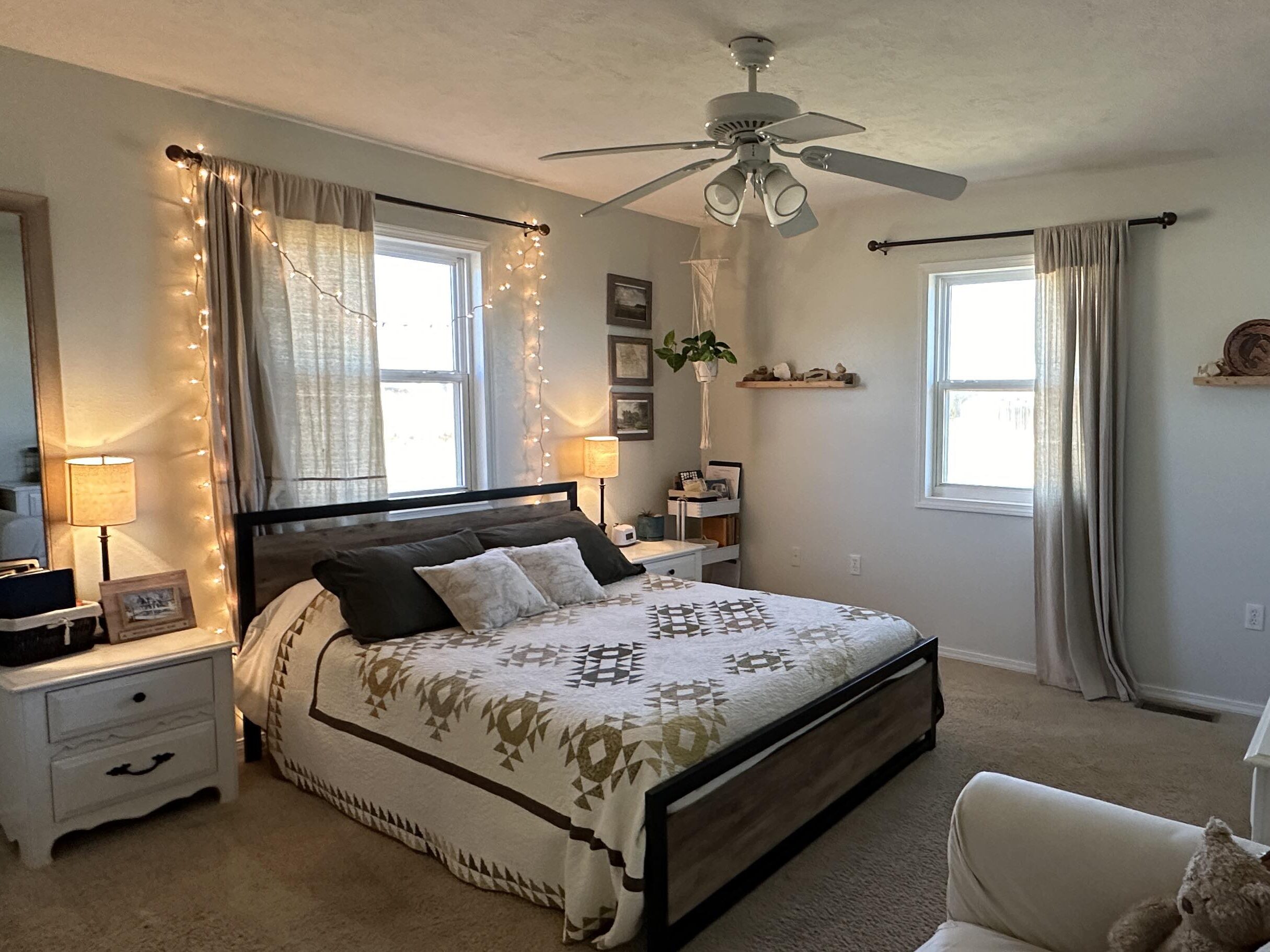 bedroom with made bed and cozy decor, clean and tidy